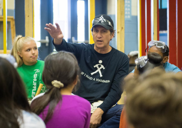 Perry Wilson, the creator of If I Had a Hammer, speaks to students at Lansdowne Elementary, during the Hammer Home Math event, where students helped build a small house using math principles. Photo by Bobby Ellis, Oct. 19, 2017