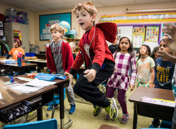 Jacob McCord, a 2nd-grader at Norton Elementary (Jefferson County), jumps during an exercise break in Marcy Van Hoose's class. Photo by Bobby Ellis, Oct. 26, 2017