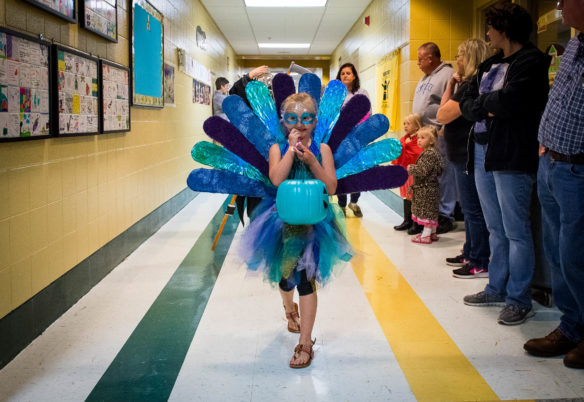 Lacie Wilson leads a costume parade down the halls of Northside Elementary. Photo by Bobby Ellis, Oct. 27, 2017