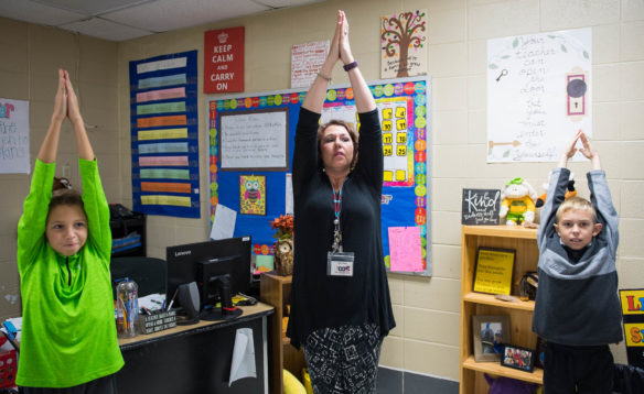 Amy Green, a 5th-grade teacher at Baker Intermediate (Clark County), center, performs yoga with her class during a mindfulness exercise. Photo by Bobby Ellis, Nov. 2, 2017
