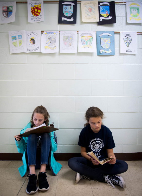 Madleine Harrington, left, and Izabella Kimbel, 5th-graders at Rich Pond Elementary work on social studies projects in the hallway. Photo by Bobby Ellis, Dec. 4, 2017