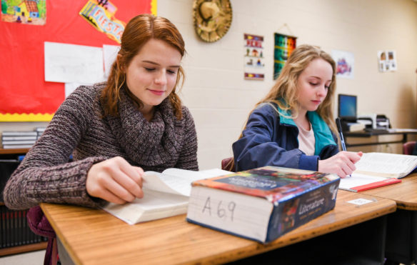Cassie Hacker, left, and Kate Garad, seniors at Bryan Station High School (Fayette County), review for a test in Laura DeVettori's Spanish immersion AP literature class. Photo by Bobby Ellis, Dec. 7, 2017