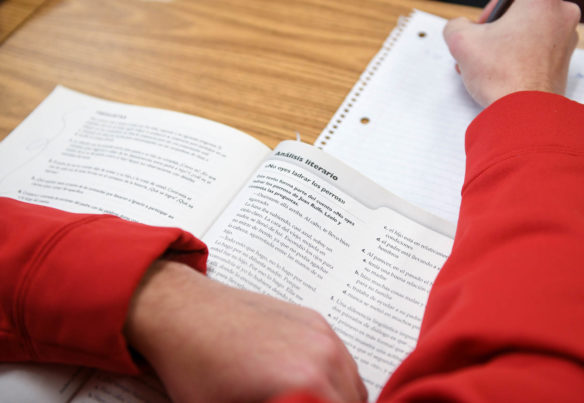 Ashton Meuser, a 12th-grader at Bryan Station High School (Fayette County), reviews a workbook written in Spanish while studying for finals in Laura DeVettori's Spanish immersion AP literature class. Cultural studies and world languages has been included as a measure of opportunity and access in Kentucky's new accountability system. Photo by Bobby Ellis, Dec. 7, 2017