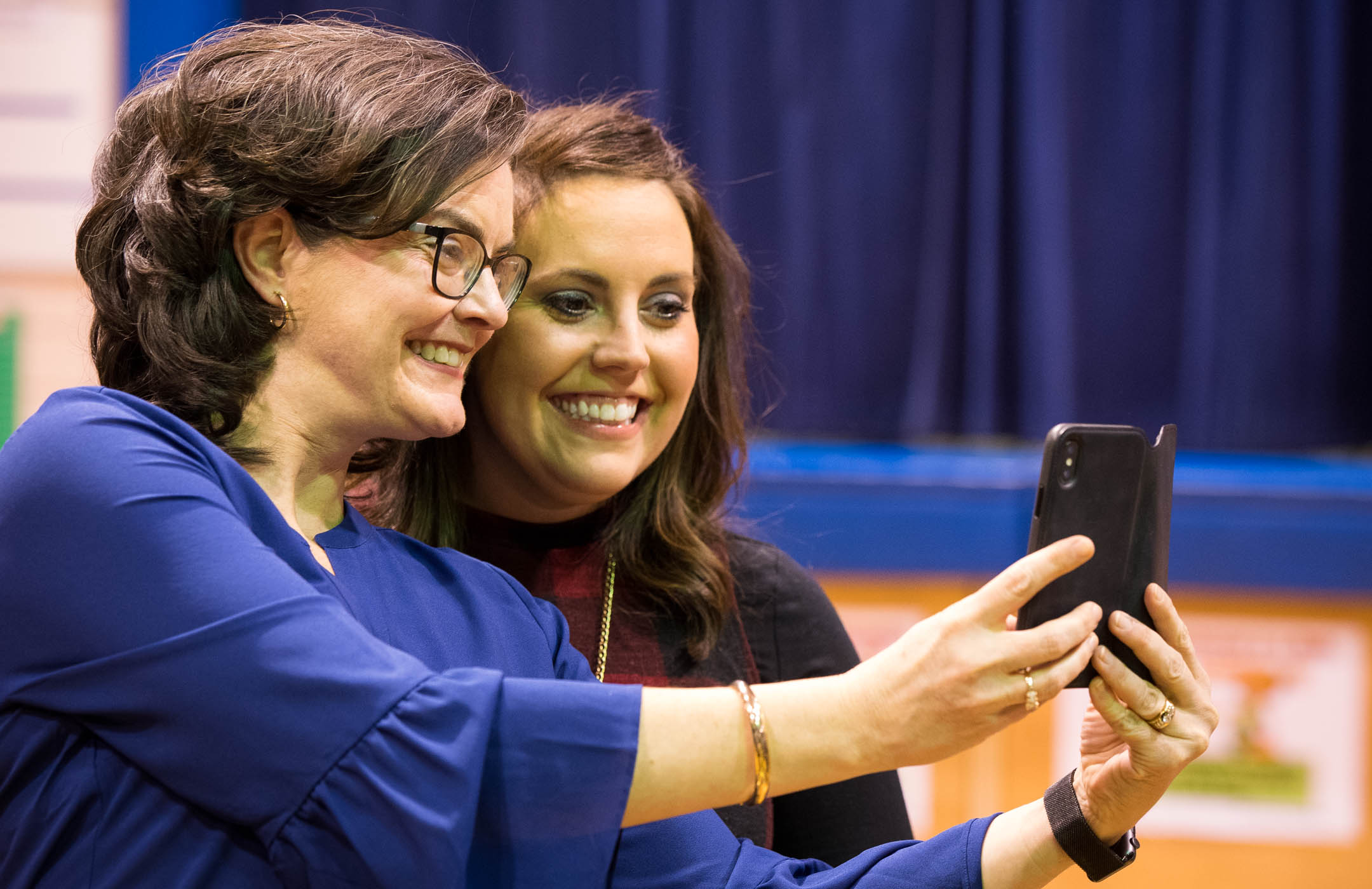 Brooke Powers, right, a 7th-grade mathematics teacher at Beaumont Elementary School (Fayette County) who was named a Milken Education Award winner Jan. 9, poses for a selfie with former Milken award winner Greta Casto, the chief information officer at Russell Independent schools, following the announcement of Powers' award. Powers is one of 44 Milken Educators who will be honored in 2017-18, and the only one in Kentucky. Photo by Bobby Ellis, Jan. 9, 2017