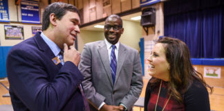 Commissioner of Education Stephen Pruitt, left, and Fayette County Superintendent Emmanuel Caulk speak with Brooke Powers after she was named as a 2017-18 Milken Educator Award winner. Powers, a 7th-grade math teacher and math department chair at Beaumont Middle School, is the only Milken Award winner from Kentucky this year, and is among just 44 honorees for 2017-18. Photo by Bobby Ellis, Jan. 9, 2018