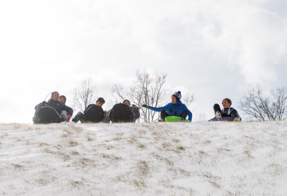 A group of Second Street School (Frankfort Indpendent) students get ready to sled down a hill near the state Capitol. Photo by Bobby Ellis, Jan. 13, 2018