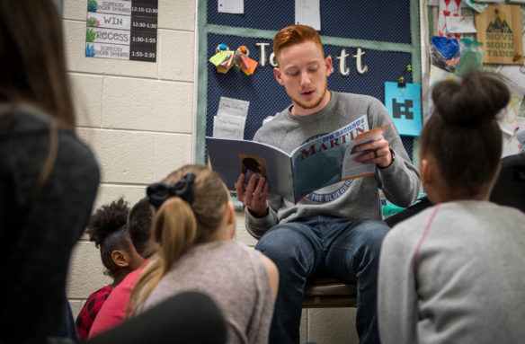 Kyle Hancock reads a book about Martin Luther King, Jr. to Buckley Hancock's 2nd-grade class at Lansdowne Elementary (Fayette County). Photo by Bobby Ellis, Jan. 24, 2018