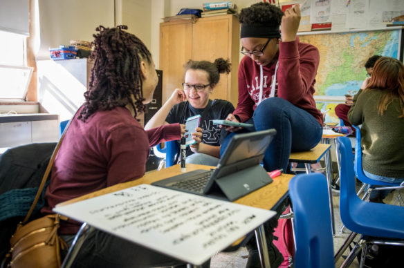 Students Nasia Craft, Skylar Dragoo and Ziona King, left to right, work on their a project focused on advancing women during their AP Human Geography class at the J. Graham Brown School (Jefferson County). Students in an AP course with the WE service learning component address local and global concerns that require hands-on innovation and problem-solving. Photo by Bobby Ellis, Jan. 25, 2018