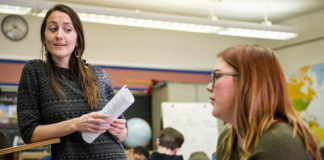 Elizabeth Byron, left, talks to freshman Ella Pena during Byron's Advanced Placement Human Geography class at the J. Graham Brown School (Jefferson County). Byron's class includes the AP with WE Service component, which incorporates service learning into AP courses. Photo by Bobby Ellis, Jan. 25, 2018