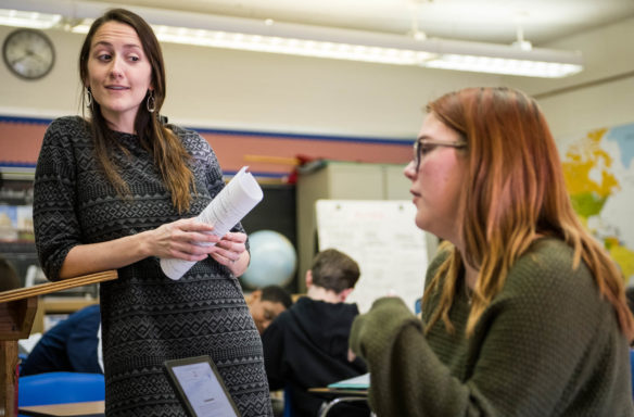 Elizabeth Byron, left, talks to freshman Ella Pena during Byron's Advanced Placement Human Geography class at the J. Graham Brown School (Jefferson County). Byron's class includes the AP with WE Service component, which incorporates service learning into AP courses. Photo by Bobby Ellis, Jan. 25, 2018