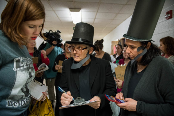 Sheila Riley, a resource and intervention teacher at Lincoln Elementary, counts up the number of students and staff member who dressed as Abraham Lincoln. Photo by Bobby Ellis, Feb. 14, 2018