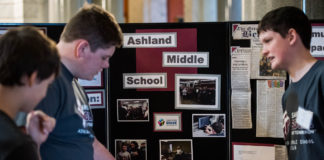 Ashland Middle School students set up their booth at the KVEC Showcase in the Capitol Rotunda. Photo by Bobby Ellis, March 6, 2018