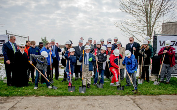 Students, administrators and construction crew members break ground on the new elementary building at the Kentucky School for the Deaf in Danville.