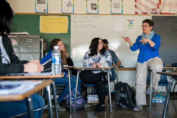 Stephanie Anderson, far right, discusses the effects of tariffs with her Advanced Placement U.S. History class at Seneca High School (Jefferson County). The Kentucky Department of Education is setting aside funds for the second consecutive year to pay for AP exams taken by students who qualify for free and reduced-price meals. Photo by Bobby Ellis, March 19, 2018