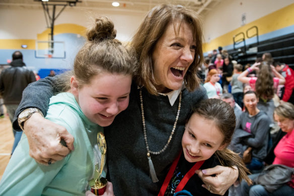 Sharon Robinson, the STEM lab teacher at Brooks Elementary (Bullitt County) hugs members of the intermediate STEM team after they won the district STEM Challenge at Mt. Washington Elementary School (Bullitt County). Photo by Bobby Ellis, March 8, 2018