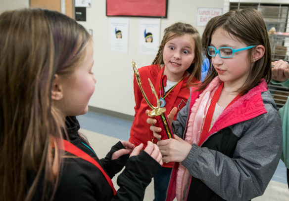 Students from Nichols Elementary (Bullitt County) look at their first place trophy after winning the primary class challenge. Photo by Bobby Ellis, March 8, 2018
