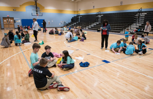 Students work to build rubber band power cars during the regional STEM challenge. Photo by Bobby Ellis, March 8, 2018