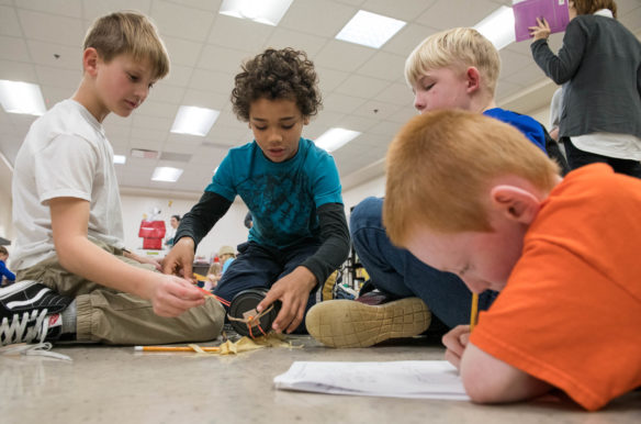 Students from Mt. Washington Elementary School (Bullitt County) work on their rubber band powered car as part of the District STEM Challenge. Photo by Bobby Ellis, March 8, 2018