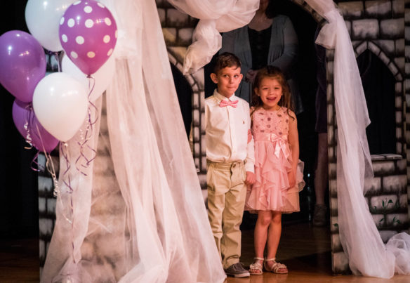 Tripp Dublin, left, and Emilie Miller are introduced during the First Grade Fairy Tale Ball at Graves Central Elementary. Photo by Bobby Ellis, March 28, 2018