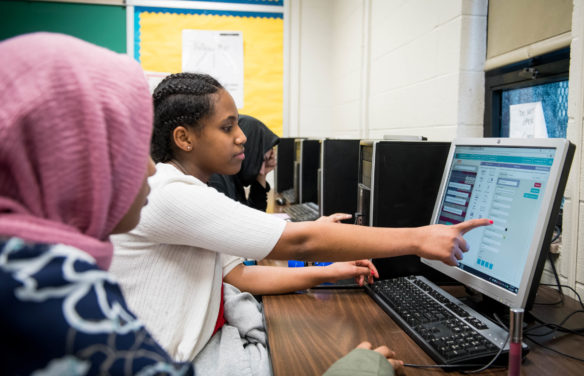 Iroquois High School students Mebrehati Welu, middle, works with Habsa Jama, left, and Mehwish Zaminkhan on an app for the AP Computer Science Principles test. The Kentucky Department of Education launched an effort last fall to expand access to and participation in computer science courses at all grade levels and to bring advanced course work to underserved populations of students. Photo by Bobby Ellis, April 23, 2018