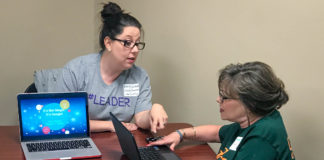Emily Northcutt, left, a library media specialist at Hearn Elementary School (Franklin County), helps a colleague at a #KYGoDigital regional event last summer in Bowling Green, where she helped lead a track for library media specialists. Seven regional meetings will be held this summer, including an online event. Photo submitted, June 8, 2017