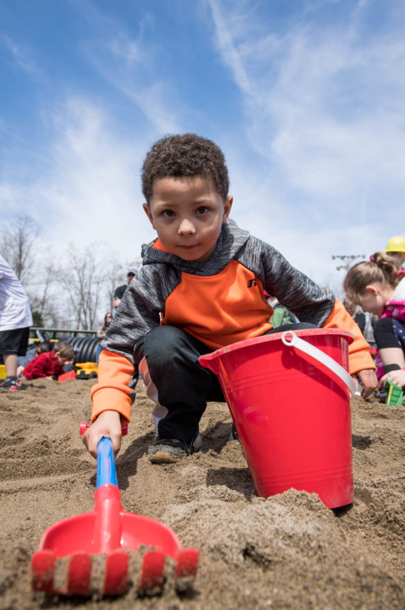 Tatum Green digs in a sand pit at the Big Dig. Children where invited to search for hidden candy in the sand pit as part of the activities at the Big Dig event at the Boone County Fair Grounds. Photo by Bobby Ellis, April 21, 2018