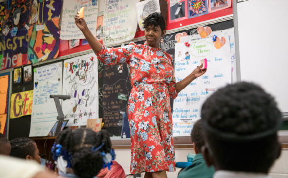 NyRee Clayton-Taylor uses hip-hop music to connect with her students during her creative writing classes at Phillis Wheatley Elementary School. Photo by Bobby Ellis, May 1, 2018