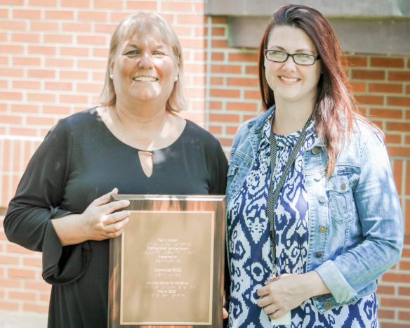 Connie Hill, left, poses with Kentucky School for the Blind Principal Jackie Williams after receiving the 2018 Paul J. Langan Award at the school’s Founder’s Day Ceremony on May 8. Hill, a KSB low vision specialist, has worked with blind and visually impaired students for more than 21 years.