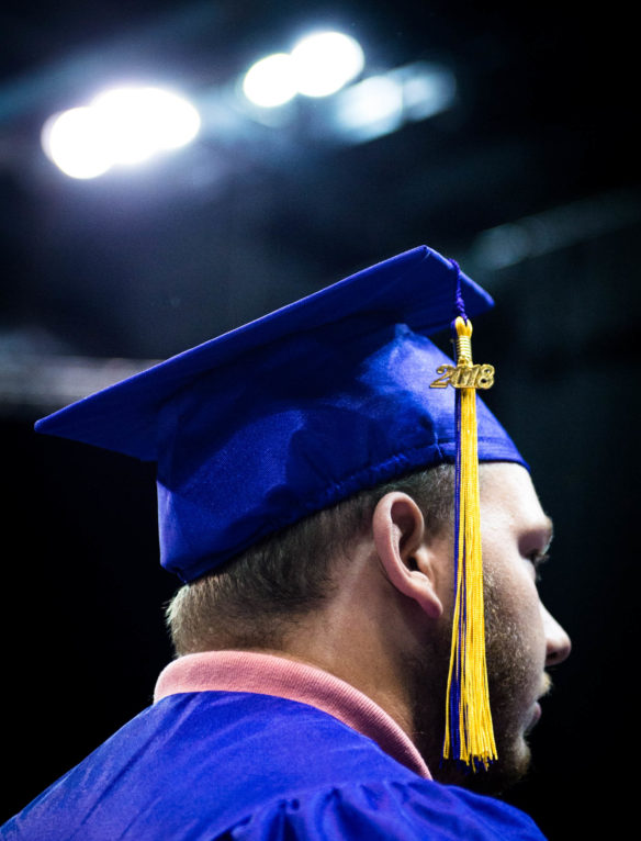 A Campbell County High School graduate enters BB&T Arena at Northern Kentucky University to take part in the 2018 graduation ceremony. Photo by Bobby Ellis, June 4, 2018