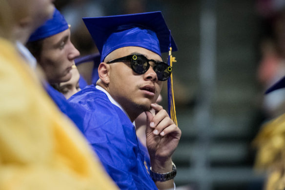 Zachary Nelson watches as Benjamin Turner gives his valedictorian speech during the Campbell County graduation ceremony. Photo by Bobby Ellis, June 4, 2018