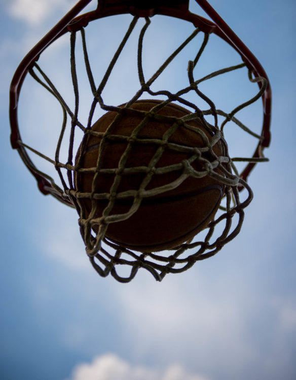 A basketball goes through a hoop during a basketball game at the FFA camp in Hardinsburg. Photo by Bobby Ellis, June 12, 2018