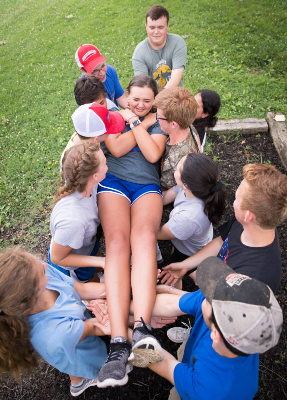 Abbi Jones, a student at Franklin Simpson High School (Simpson County), is caught by her teammates during a trust fall exercise at the FFA summer camp. Photo by Bobby Ellis,