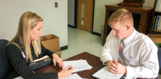 Garrett Duncan, right, a student at Calloway County High School, interviews with Allyson Foster, an executive adviser in the Kentucky Department of Community Based Services. The interview is part of a program in which high school students interested in a career in social work can obtain apprenticeships in local DCBS offices. Duncan was the first student enrolled in the pilot program, which fills a need in a field in which it can be difficult to recruit and retain workers. Photo submitted
