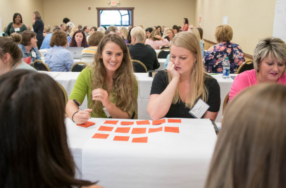 School counselors map out different problems faced by students and how to help them overcome them during the KACTE conference in Louisville. Photo by Bobby Ellis, July 23, 2018