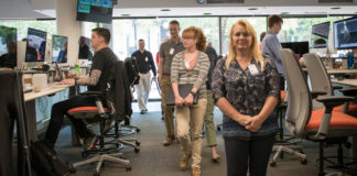 Teachers tour the Digital Experience Center at Humana in Louisville. As part of the visit, computer science teachers also got to speak to Humana employees and interns about careers available at the company, such as cybersecurity, end user computing and working in the data center. Photo by Bobby Ellis, June 7, 2018