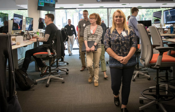 Teachers tour the Digital Experience Center at Humana in Louisville. As part of the visit, computer science teachers also got to speak to Humana employees and interns about careers available at the company, such as cybersecurity, end user computing and working in the data center. Photo by Bobby Ellis, June 7, 2018