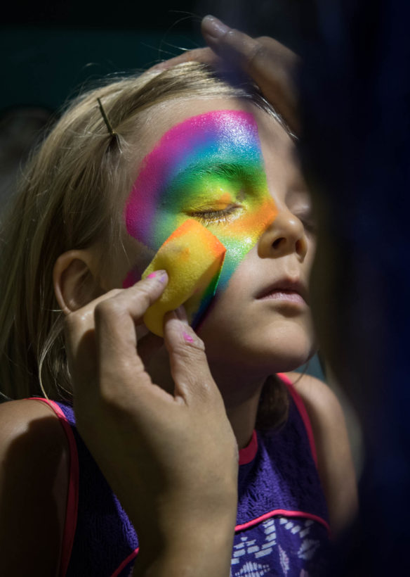 Kira Kindoll, a student at Milton Elementary School (Trimble County), gets her face painted at Jurassic Quest. Photo by Bobby Ellis, July 6, 2018