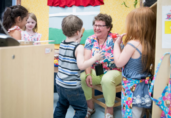 Rita Renfrow plays with students in a preschool classroom at North Butler Elementary (Butler County). Renfrow said she is appreciative of the Fred Award, but doesn't feel she should be honored for doing what she loves. Photo by Bobby Ellis, Aug. 27, 2018