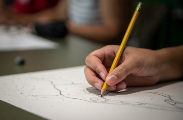 Matthew Travers sketches a cow skull during a drawing class taught by Bill Berryman during the 2018 Festival of Learnshops at Berea. Photo by Bobby Ellis, July 19, 2018