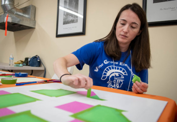 Erin Hubbard, an art teacher at Vine Grove Elementary (Hardin County), creates a quilt pattern during a quilt block painting class at the Festival of Learnshops. Photo by Bobby Ellis, July 19, 2018