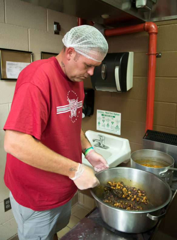 Joey Parks, a cook at Henry County Elementary, mixes chili during the nutrition training lab. The lab topics included culinary basics, scratch cooking and meat alternatives. Photo by Bobby Ellis, Aug. 1, 2018