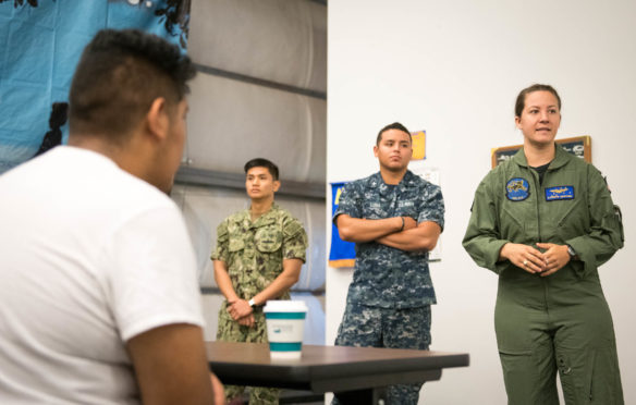 Lt. Kathryn Martinez, right, AT3 Joshua Luna and AT2 Justin Escobar give a presentation about working as a flight crew in the United States Navy. Photo by Bobby Ellis, Aug. 23, 2018