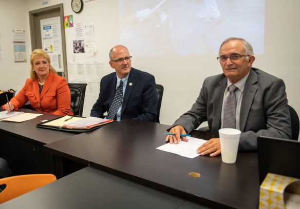 Mary Taylor, training specialist at the Kentucky Department of Education, from left, Scott Stump, assistant secretary of the United States Department of Education, and David Horseman, associate commissioner at the Kentucky Department of Education, meet with parents, students and Fayette County School officials during a visit highlighting the high school apprenticeship program at AMTECK in Lexington. Photo by Bobby Ellis, Sept. 12, 2018