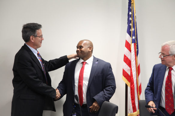 Kentucky Board of Education member Joe Papalia greets Wayne D. Lewis after the board's Oct. 2 meeting, where board members voted unanimously to take the next step in making Lewis the next commissioner of the Kentucky Department of Education. Lewis has served as interim commissioner since April 2018. Photo by Megan Gross, Oct. 2, 2018