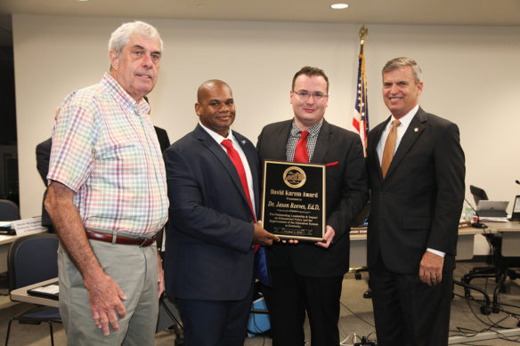 The Kentucky Board of Education named Jason Reeves, second from right, dean of educational studies and professor of education at Union College in Barbourville, as the recipient of the second annual David Karem Award during its regular meeting Oct. 2 in Frankfort. Presenting the award were, from left, former KBE member and state legislator David Karem, Interim Commissioner of Education Wayne Lewis and Board Chair Hal Heiner. Photo by Megan Gross, Oct. 2, 2018