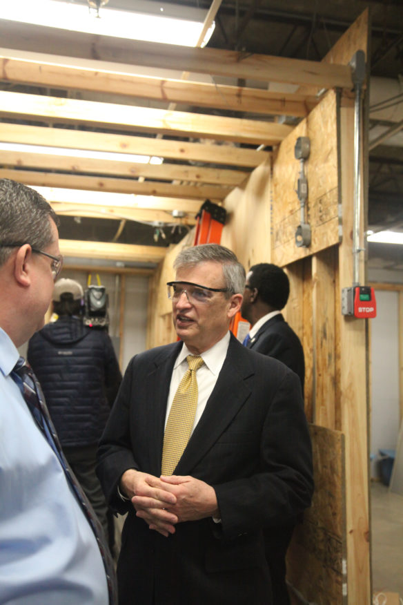 Kentucky Board of Education Chairman Hal Heiner talks with construction instructor at Bullitt County Area Technology Center about the construction class and the benefits students get from it. Photo by Megan Gross, Jan. 29, 2018