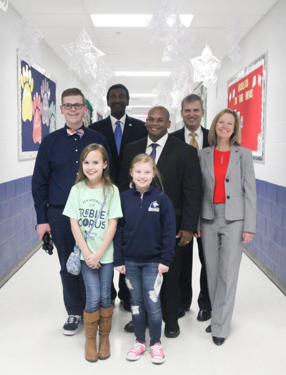 Kentucky Board of Education (KBE) Vice Chairman Milton Seymore, from back left; Education Commissioner Wayne Lewis; KBE Chairman Hal Heiner; and Amanda Ellis, chief academic officer and deputy commissioner at the Kentucky Department of Education, pose with their three student tour guides from the Old Kentucky Home Elementary School. Photo by Megan Gross, Jan. 29, 2018