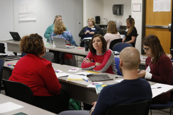 Shawnda Fizer, a 5th-grade teacher at Ewing Elementary School (Fleming County), discusses “The Opportunity Myth” study with colleagues at a meeting of the Commissioner’s Teacher Advisory Council in Frankfort. The study released last year concludes that while students tended to succeed equally on grade-level work, many students of color are not being given grade-level assignments. Photo by Mike Marsee, Jan. 18, 2019