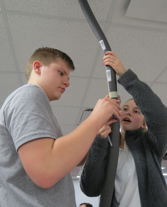 Bullitt Central High School students Cameron McCoy and Lynzi Huggett work on their roller coaster track. Photo submitted