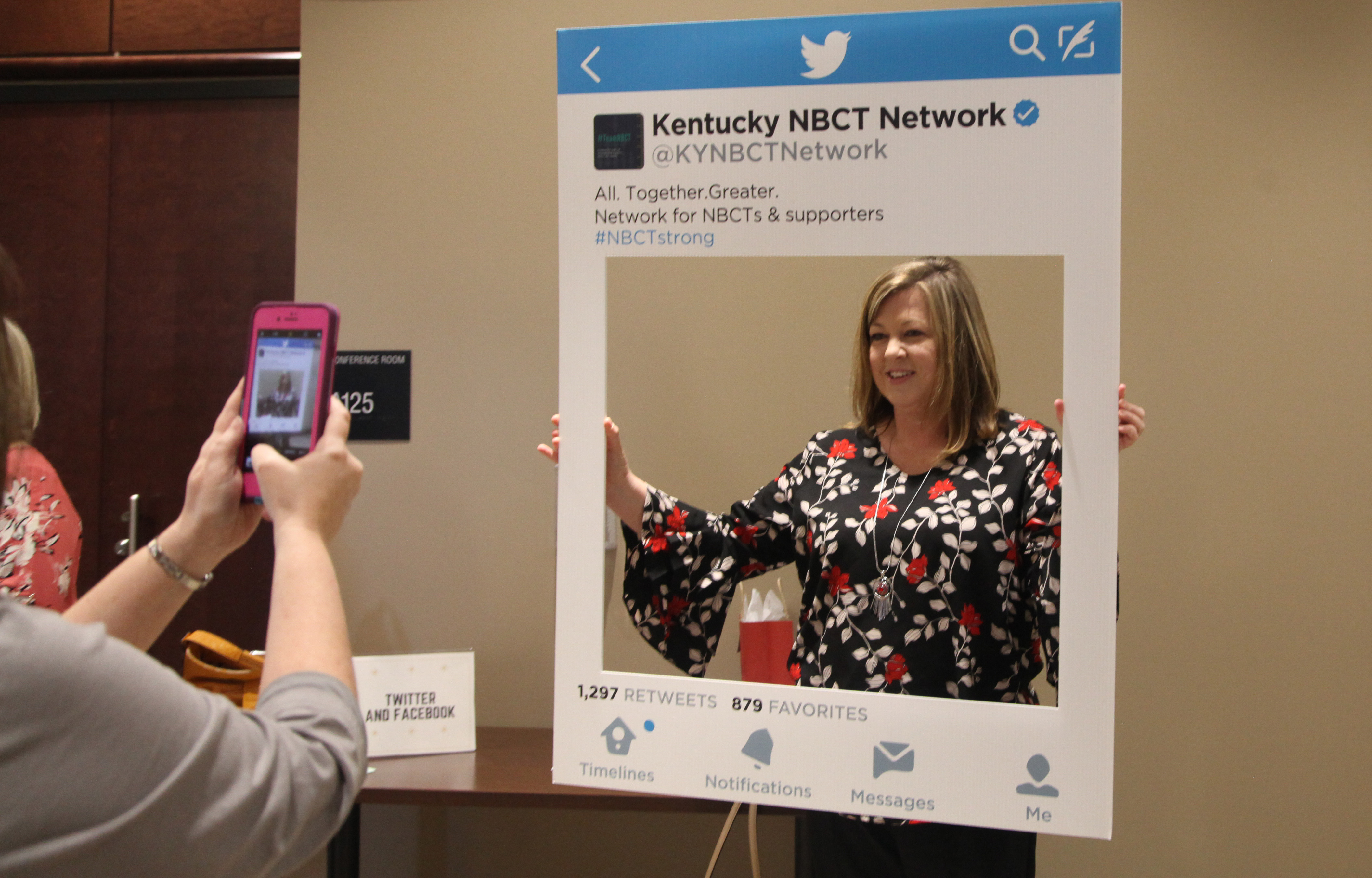 Melissa Smith, a 5th-grade teacher at LBJ Elementary School (Breathitt County), has her picture taken with a Twitter post photo frame at a recognition ceremony for teachers who have been newly certified by the National Board for Professional Teaching Standards in Frankfort. Smith is among 191 Kentucky teachers who earned National Board certification in 2018. Photo by Megan Gross, Feb. 19, 2019